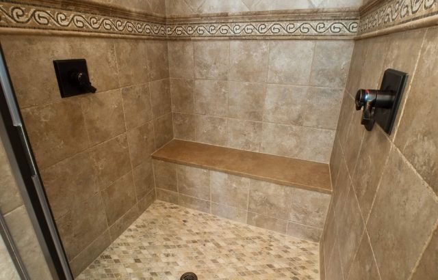 how to clean stone shower walls
