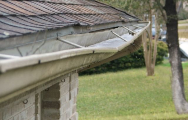 how to install gutters on rafter tails