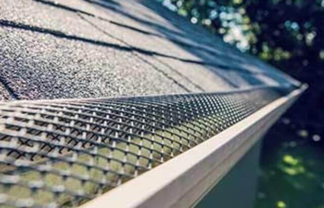 how to stop leaves blocking gutters