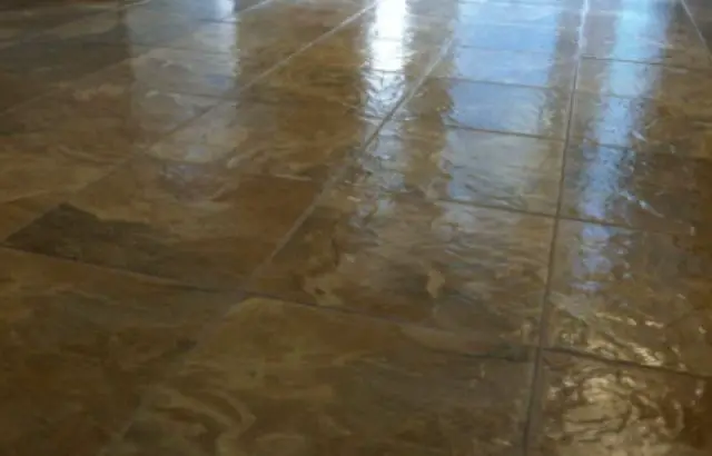 Red stain on linoleum floor