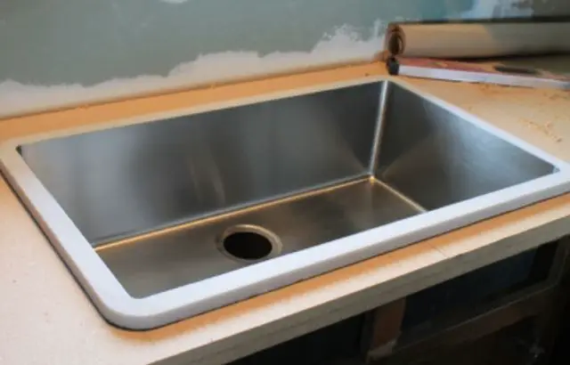 drop-in sink installation on quartz countertop
