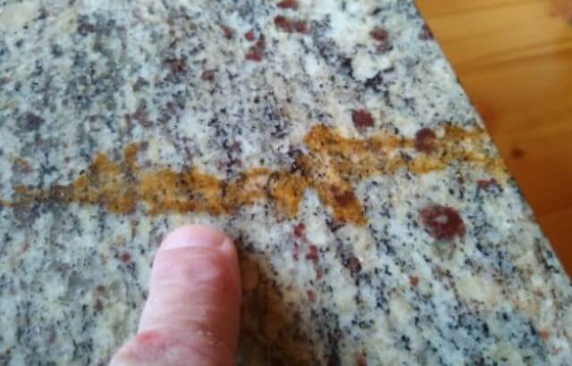 remove oil stain from granite baking soda