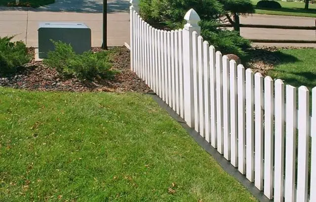 how to keep weeds from growing under the fence