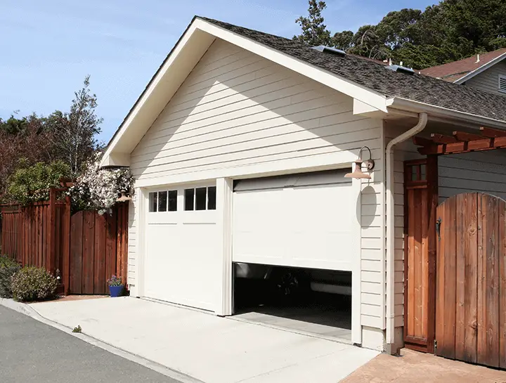 What is the best way to repair a garage door that keeps going up and down?