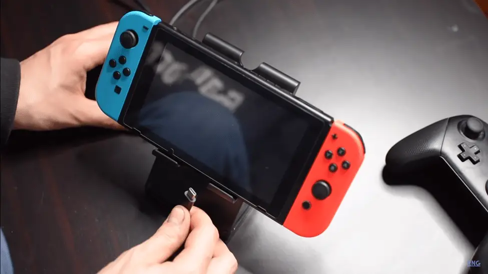 Connect your Nintendo Switch to the adapter you purchased.