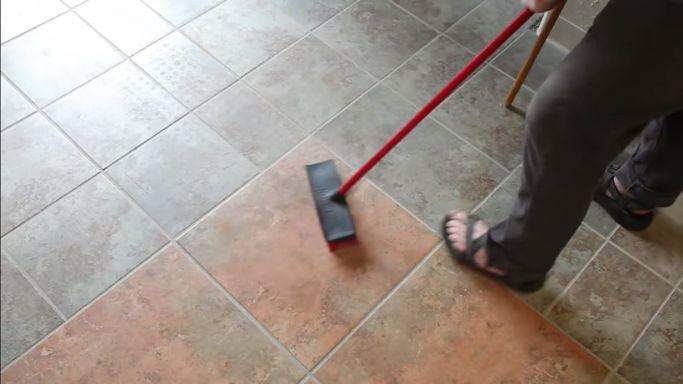 Scrub the floor with a brush