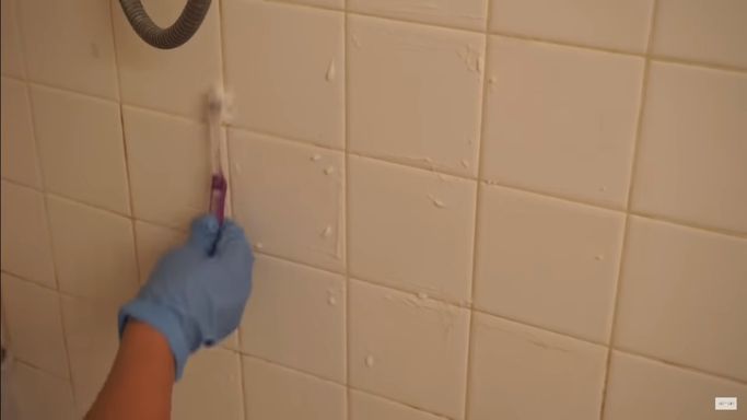 Use a soft brush to scrub the tiles.