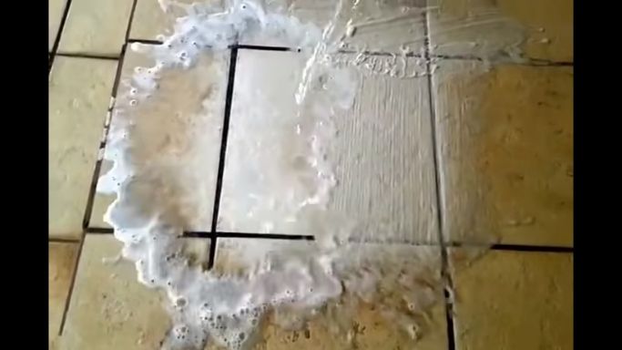 Apply baking soda paste on porous stone tiles