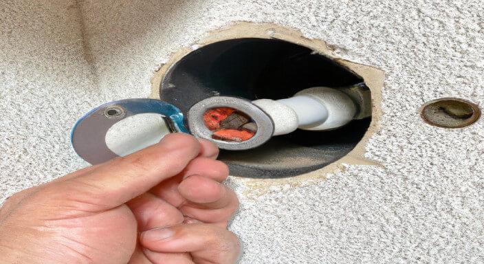 Remove the screw holding the dryer vent to the wall.
