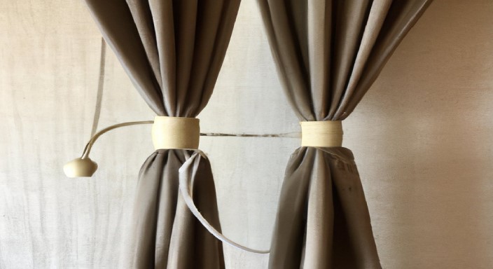 Hang both curtains together using additional strings/cords or weights