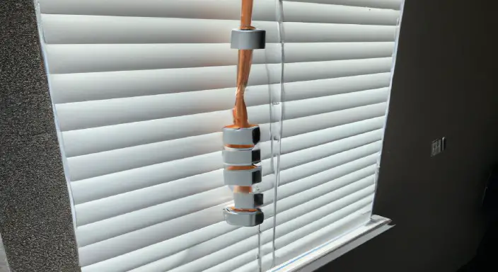 Pull the cord or lift to lower the blinds
