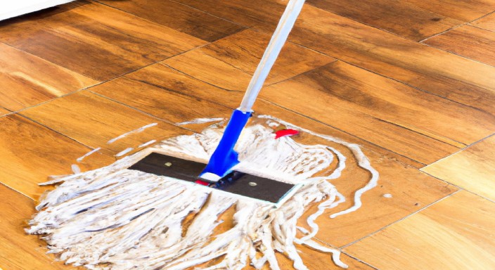 Rinse the mop and apply a second round of cleaning solution