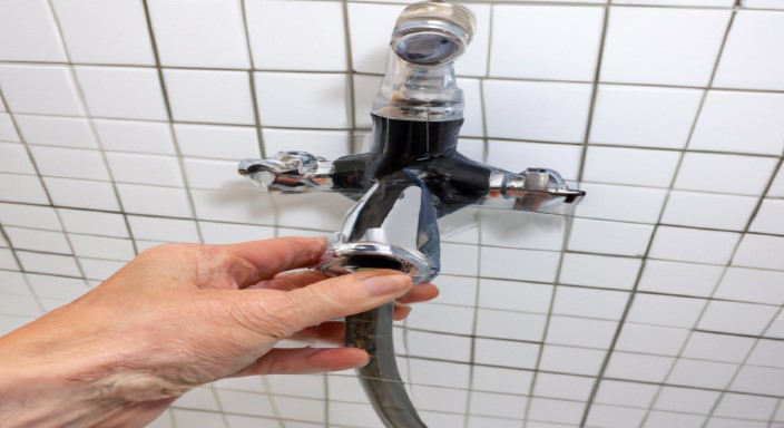 Detach the hot and cold-water supply hoses from the faucet assembly.