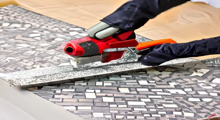 Cut the mosaic tile with a power tile cutter 
