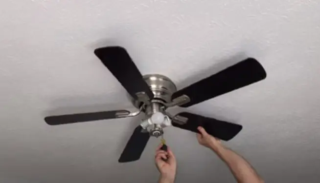 Step 2: Remove the fan blades using a screwdriver.