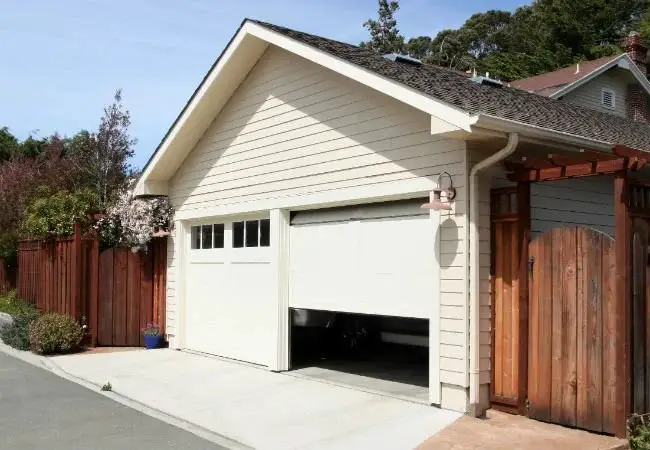 Step 5: Hold the button until the garage door opens.