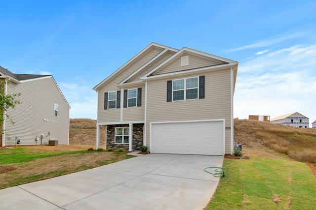 Press and hold the chosen Home Link button while the garage door opener light is flashing.