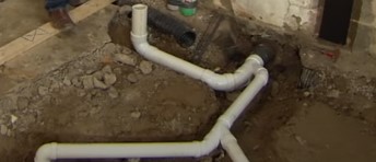 Plan a route for a 2-inch PVC pipe from the toilet location to the main vent stack.